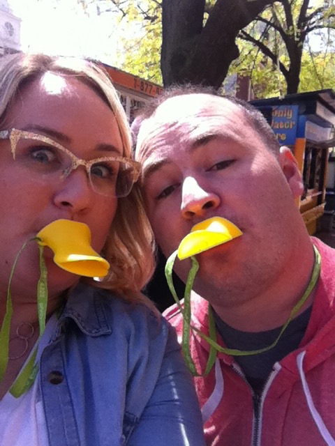 Photo of Broc & Elizabeth with duck bill whistles in their mouths